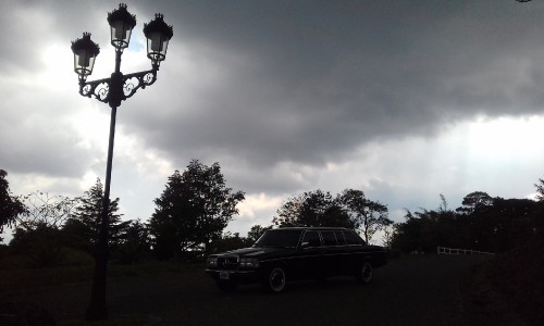 MERCEDES 300D LIMOUSINE. COSTA RICA DUSK WITH CLOUDY SKIES.