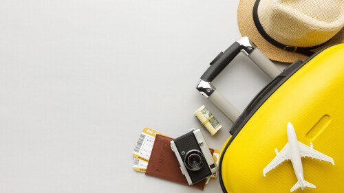 flat-lay-yellow-luggage-with-copy-space-scaled.jpg
