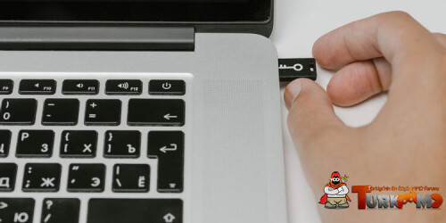 Close-Up-Image-of-a-Man-Inserting-USB-Drive-To-Laptop.jpg