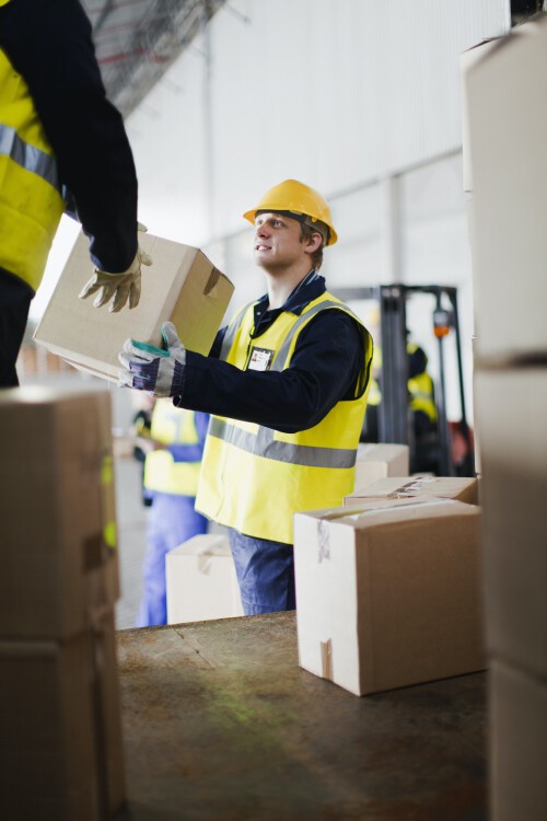 workers-unloading-boxes-from-truck.jpg