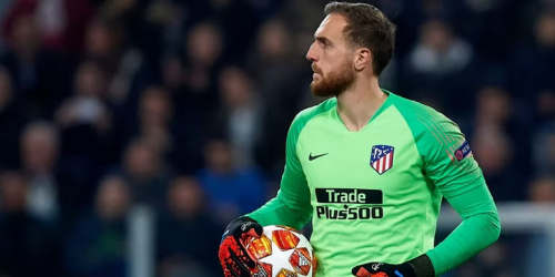 Oblak holding a football