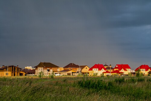 horizontal-shot-colorful-houses-cloudy-sky.jpg
