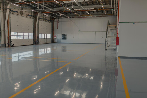 6520575c30568ec6b7b3867c_epoxy-waxed-flooring-with-colorful-signage-1.jpg